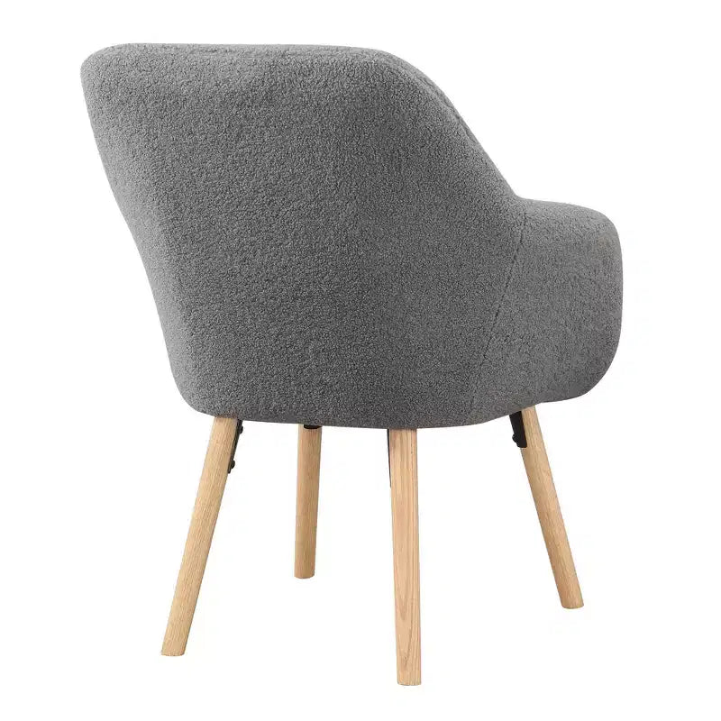 Poltroncina con braccioli Charlotte Wingback in simil montone con struttura in legno di gomma naturale